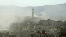 Sirijos opozicijai priklausančio televizijos kanalo „Shaam News Network“ pateiktas dūmų virš pastatų rytų Gutoje vaizdas, kurį Sirijos valdžios priešai vadina nuodingų dujų vaizdu